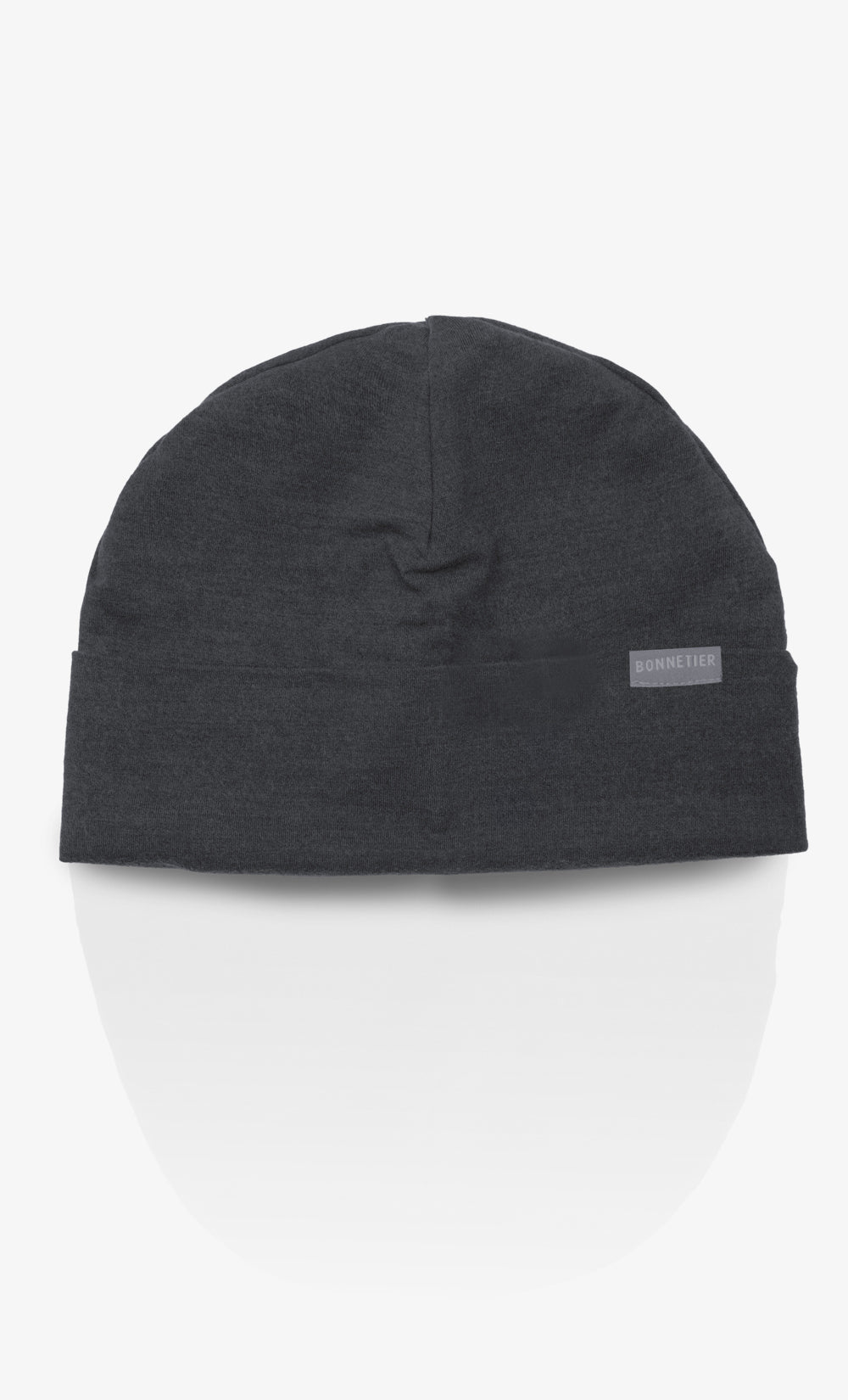 Tuque Toundra BONNETIER en flanelle 100 % laine mérinos noir chiné avec rebord replié, fabriquée au Canada.